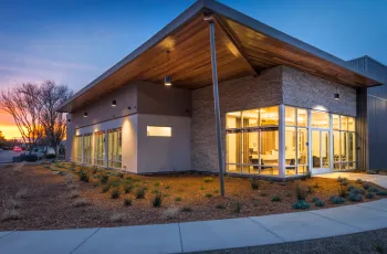 Modern dental office exterior at sunset